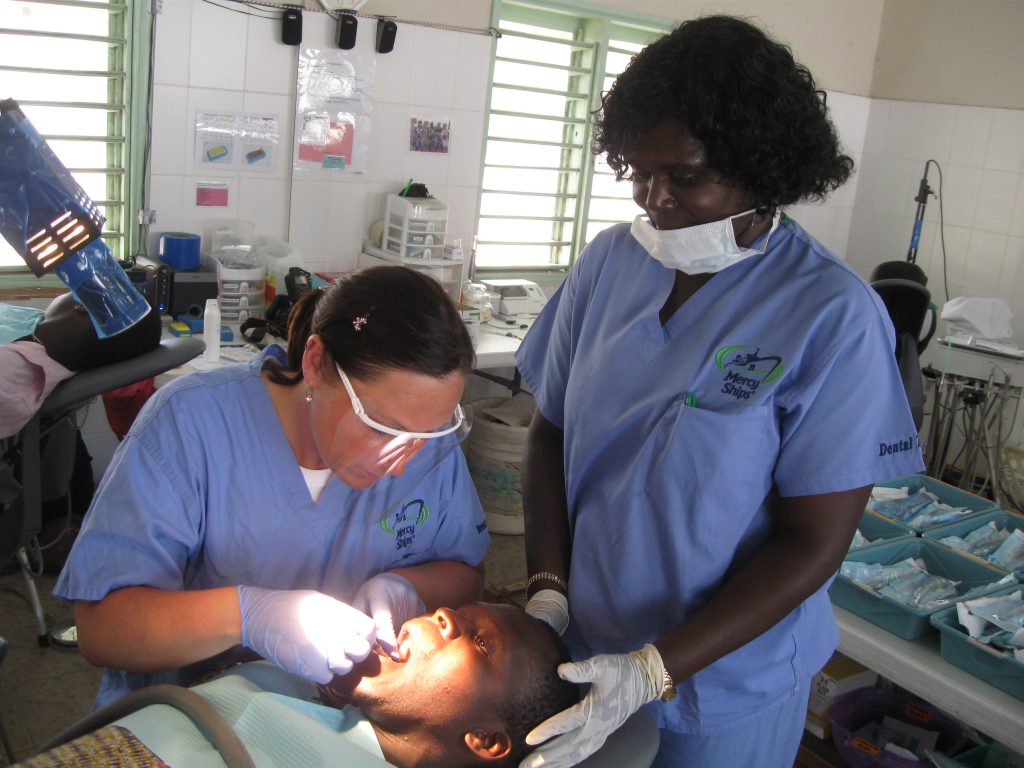 Kate Rogers performing a filling on a previous volunteer mission in Africa